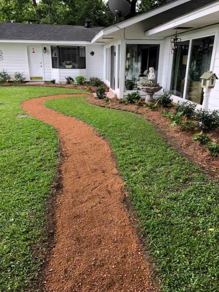 decomposed granite is great base for flagstone pathways. This landscape project was completed by professional landscapers in Sterlington, La