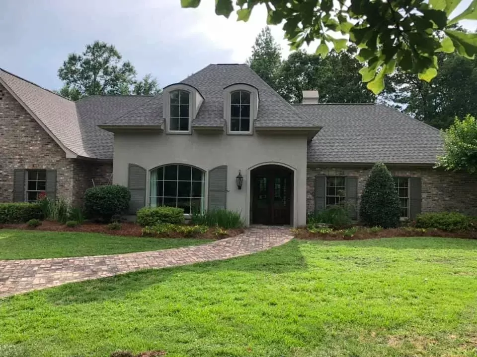Landscape maintenance with pine straw and trimming in Monroe, La