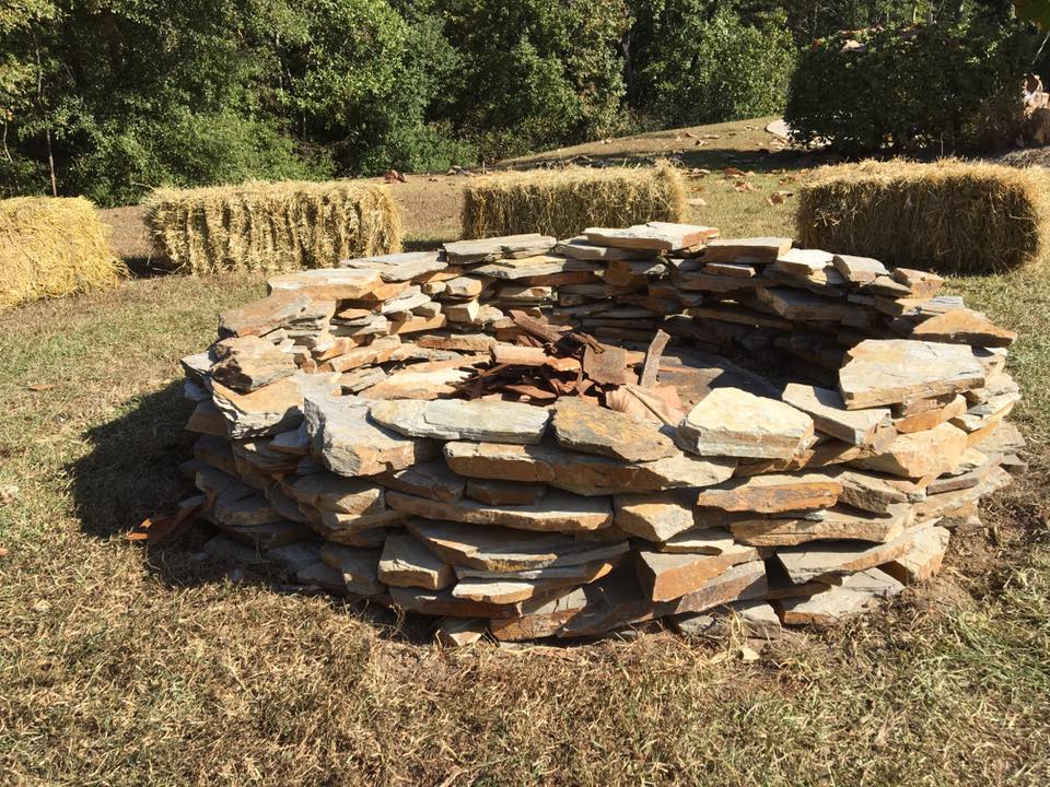 dry stacked fire pit designed and installed with flagstone